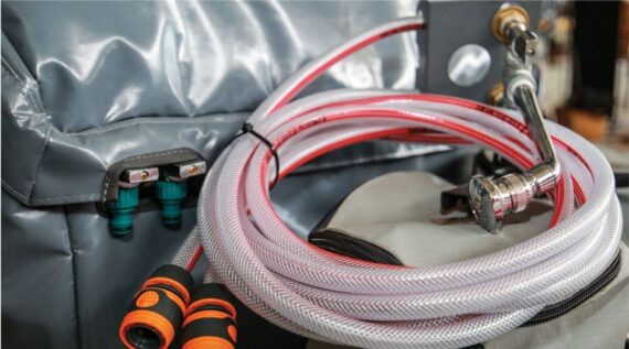 Water distribution hoses with showerhead attachment in the Conqueror Compact Platinum Edition.