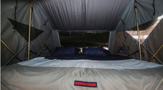 Interior view of the rooftop tent with a double bed in the Conqueror Compact Platinum Edition.