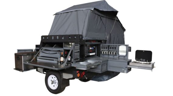 Conqueror Compact Platinum Edition trailer fully set up with rooftop tent, fridge, storage space, and kitchenette.