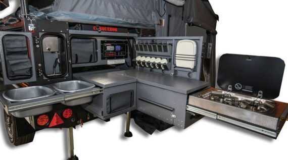 Full view of the fully-equipped kitchenette in the Conqueror Compact Platinum Edition trailer.